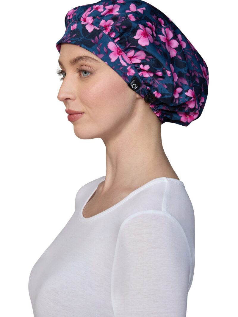 Colorful flowers and blooms print koi shower scrub cap designed for afros and fuller/longer hairstyles, equipped with ear-saving buttons for face masks.