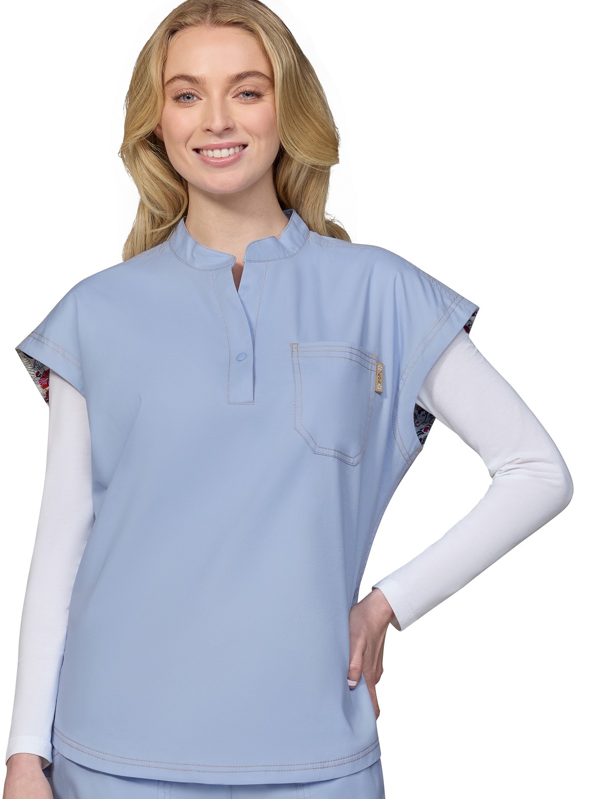 Cotton based split neck ladies scrub top with a relaxed fit and snap button at collar