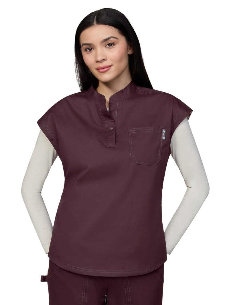 Cotton based split neck ladies scrub top with a relaxed fit and snap button at collar