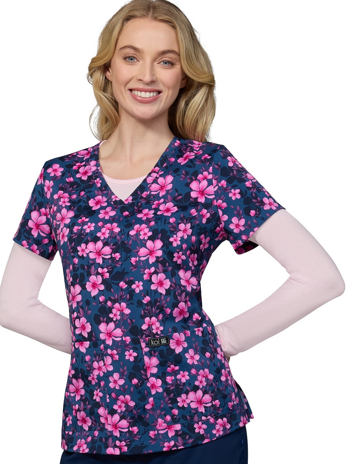 koi ladies print scrubs top with pink hibiscus flowers and petals on navy background